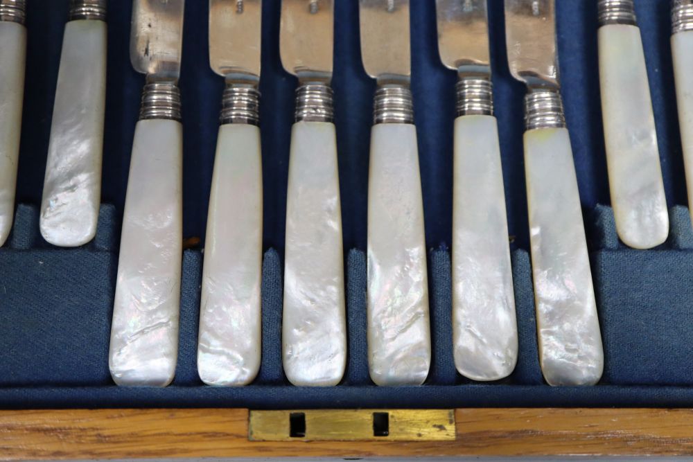 A set of ten William IV mother of pearl handles dessert knives, Atkin & Oxley, Sheffield, 1836 and a set of later similar forks